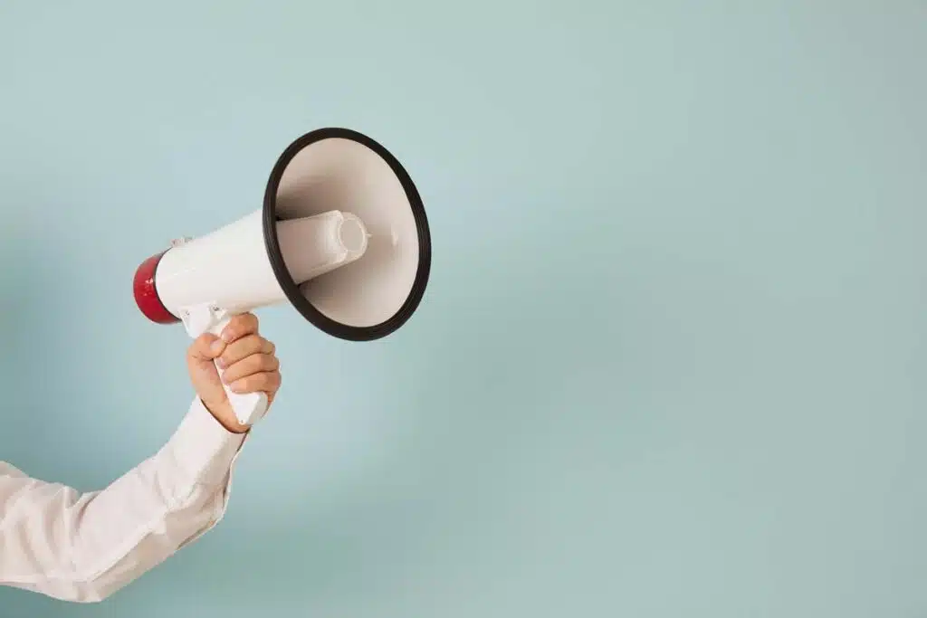 Close up of a person holding a megaphone, representing the top recalls for the week of Sept. 11.