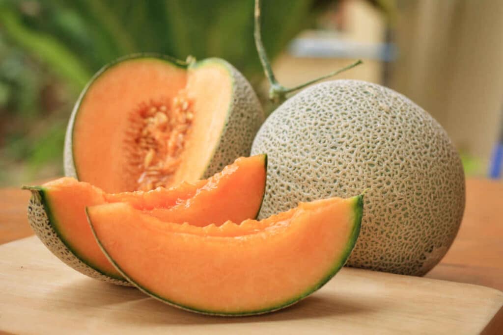 Whole and sliced cantaloupe representing the cantaloupe recall.
