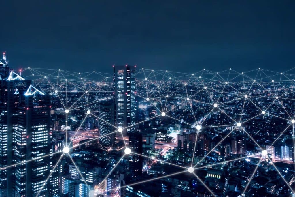A city at night with a network connection overlay, representing net neutrality rules.