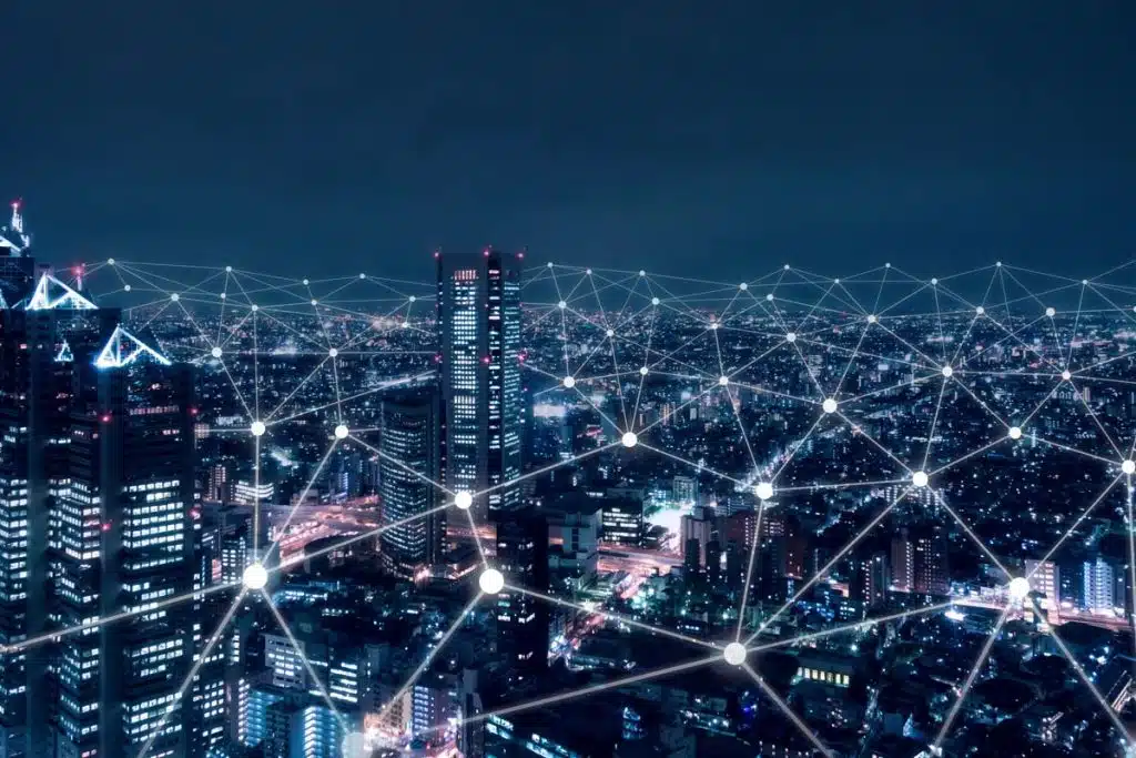 A city at night with a network connection overlay, representing net neutrality rules.