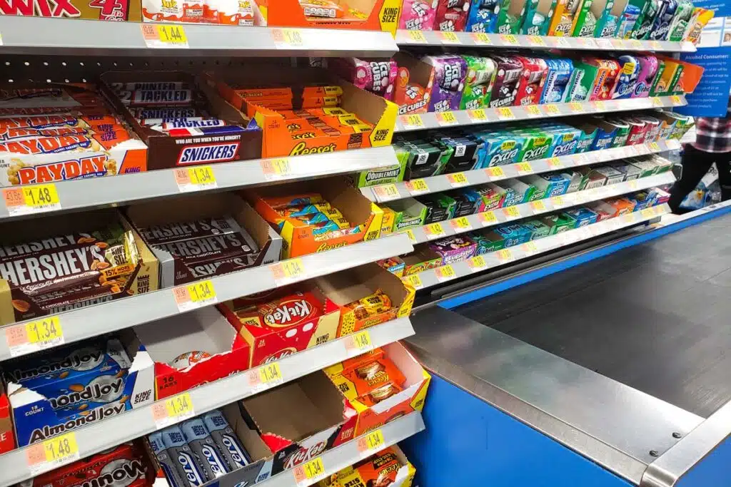Close up of impulse buy items at a checkout in a supermarket, representing the Slime Liquid Candy class action.