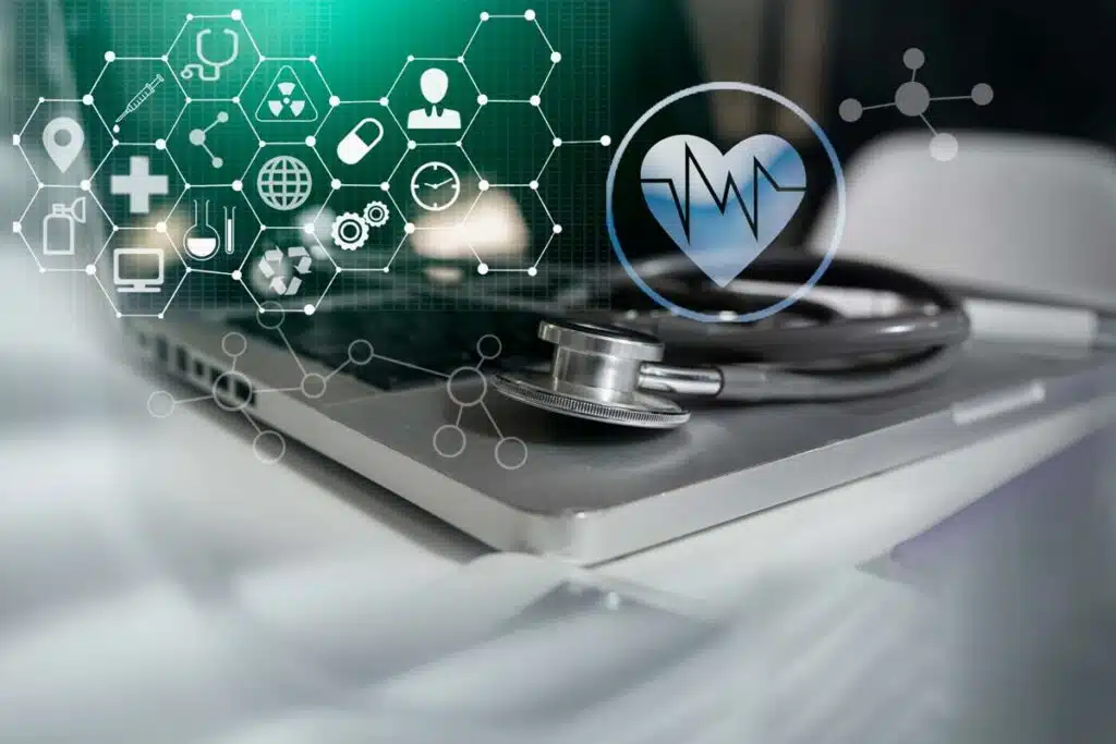 Close up of a stethoscope atop a laptop keyboard with a data concept overlay, representing the Salud Family Health data breach class action lawsuit settlement.