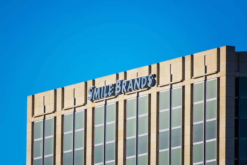 Close up of Smile Brands signage on its headquarters building, representing the Smile Brands data breach class action lawsuit settlement.