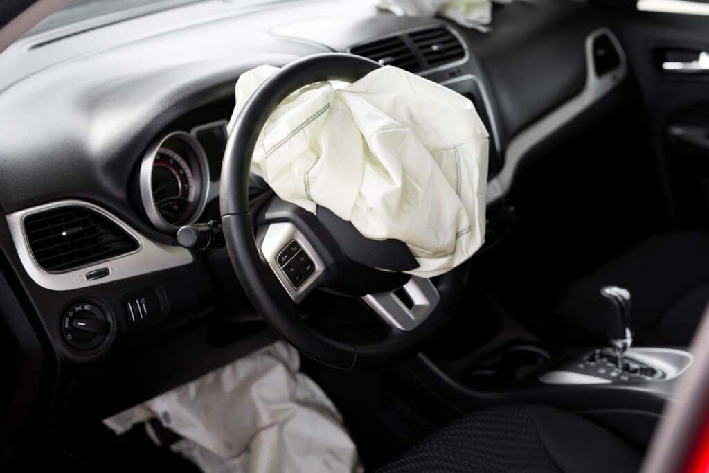 Close up of deflated airbag in vehicle, representing the air bag inflator recall recommendation.