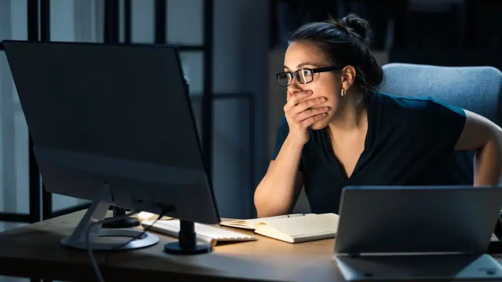 Surprised employee finding data breach, representing the Cavender employee data breach class action lawsuit settlement.