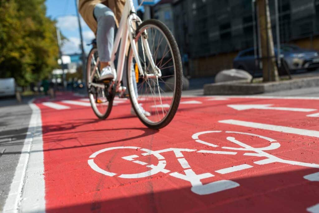 Close up of a bike rider riding in the bike lane, representing bicycle parts and bikes under recall.