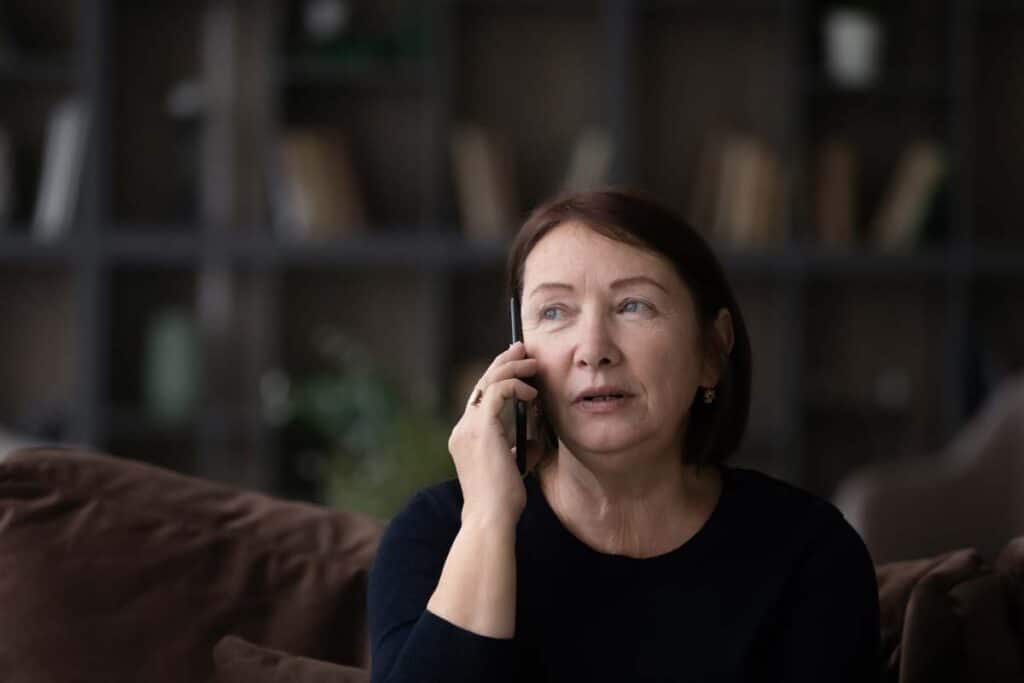 A woman talks on the phone, representing the Bissell recorded customer service calls class action.
