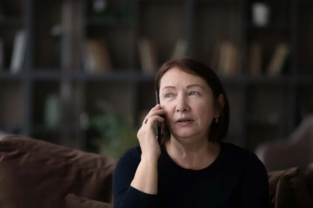 A woman talks on the phone, representing the Bissell recorded customer service calls class action.