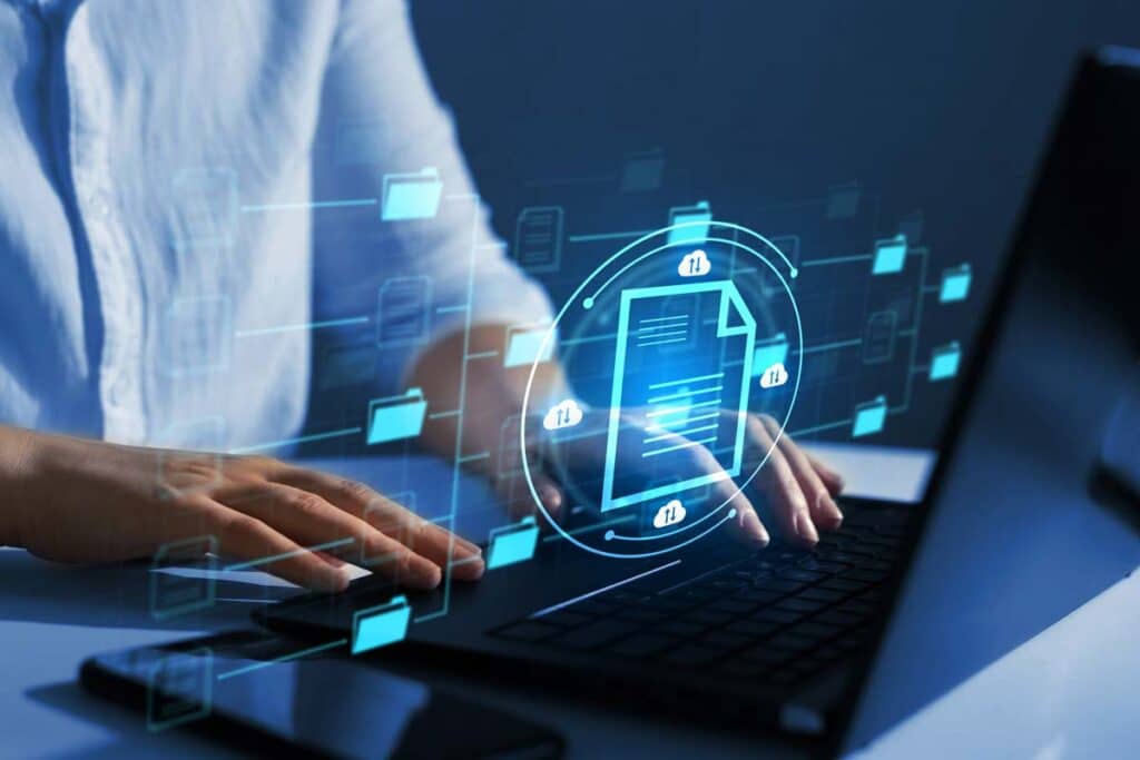 Close up of man typing on a keyboard with a data concept overlay, representing the Community Surgical Supply class action lawsuit settlement.