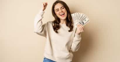 Happy woman with cash in hand