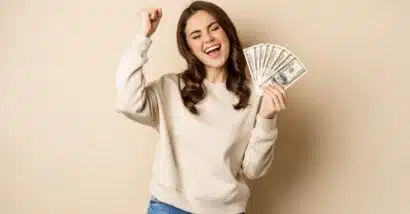 Happy woman with cash in hand