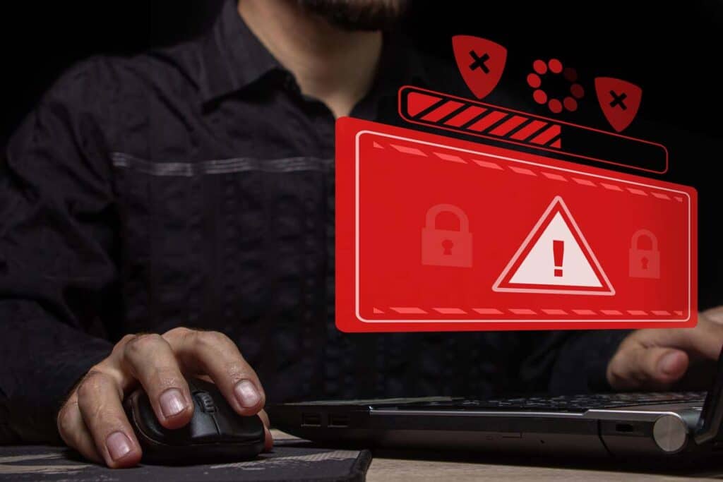 A man using a computer with data breach concept overlay, representing the Magellan Health data breach class action lawsuit settlement.
