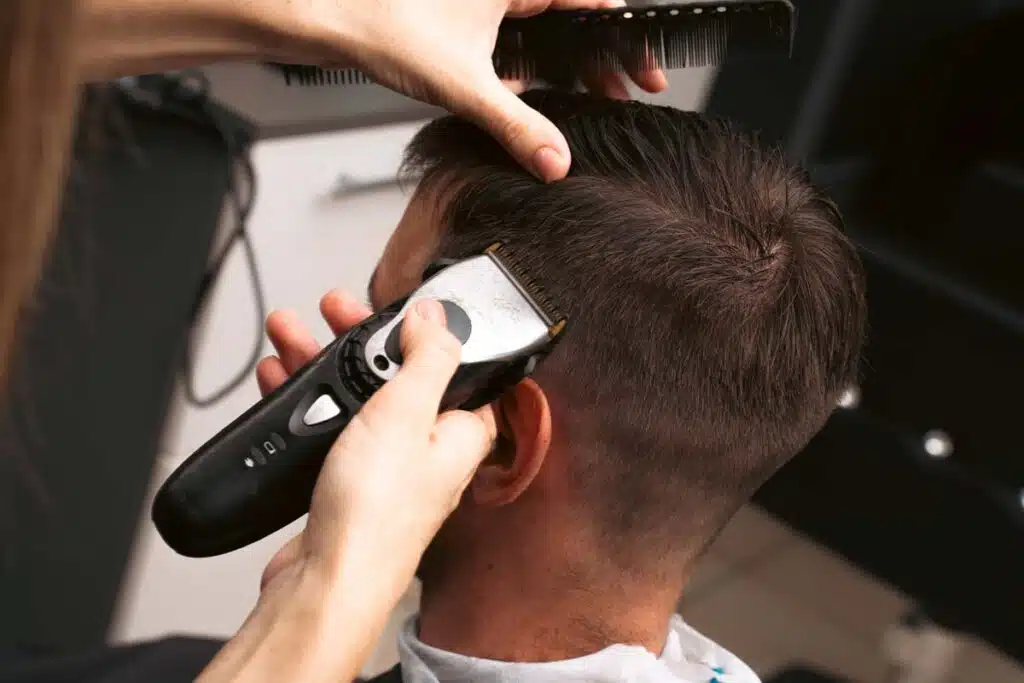 Close up of a man getting his haircut, representing the Lady Jane's class action.