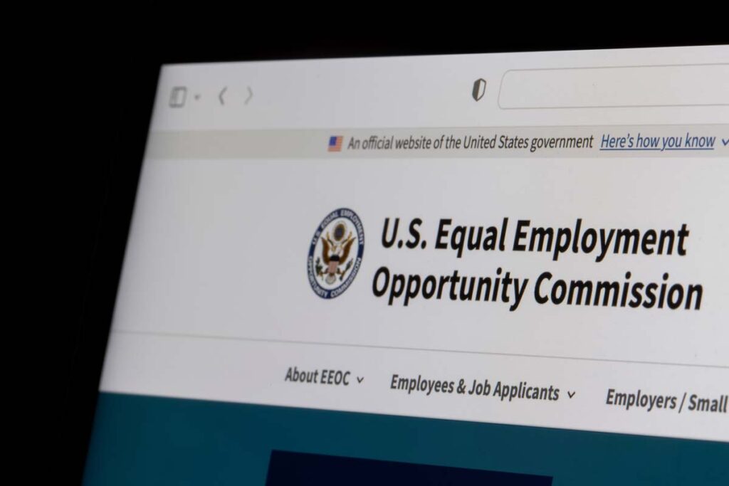 Close up of EEOC logo displayed on a computer screen, representing the EEOC's workplace harassment guidance.