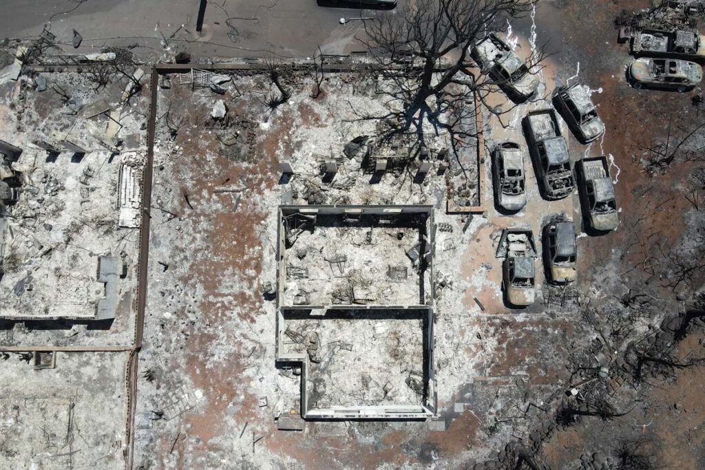 Aerial view of burned debris in Lahaina, representing the Hawaii wildfire investigation.