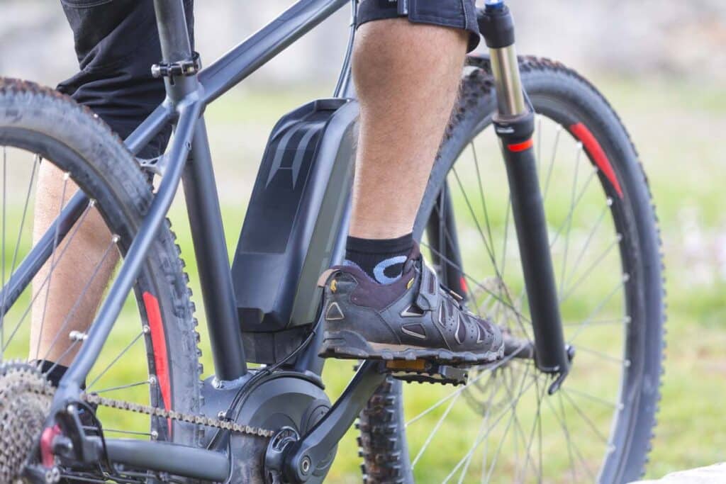 Close up of a man riding an E-Bike, representing e-scooter and e-bike injuries.