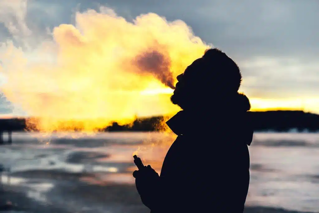 Silhouette of a man vaping, representing the Dunkin Vapin' Donuts lawsuit.