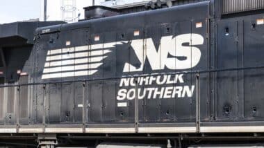 Close up of the Norfolk Southern logo on the side of a train engine, representing the Norfolk Southern train derailment.