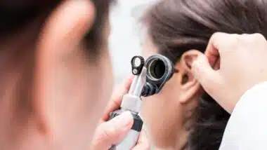 Doctor examined the patient's ear with Otoscope. Patient seem to have problems with hearing.