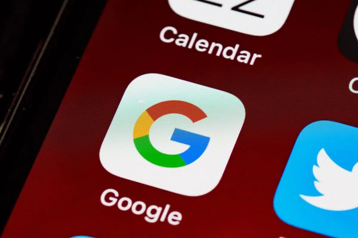 Close up of Google app displayed on smartphone home screen, representing the Android and Google Play Store antitrust litigation.