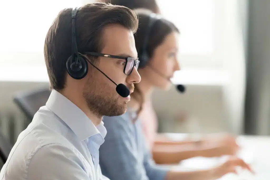 A worker wearing a headset while making a call, representing the Rocket Mortgage calls class action.