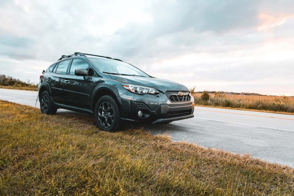 A 2021 Subaru Crosstrek Sport on an isolated road, representing the Subaru class action.