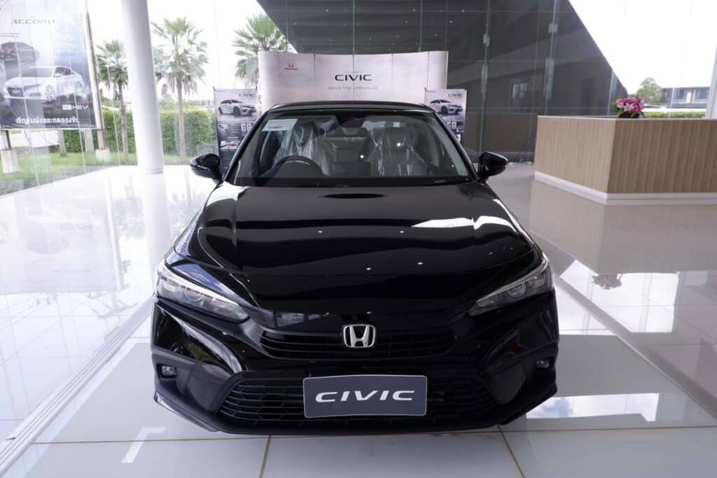 A black Honda Civic in a showroom, representing the Honda Civic recall.