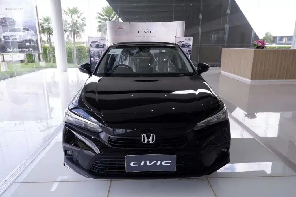 A black Honda Civic in a showroom, representing the Honda Civic recall.