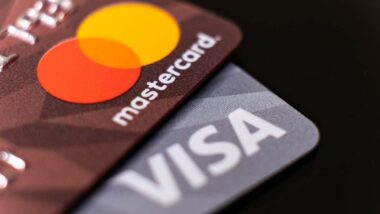 Close up of Mastercard and Visa logo on cards, representing the Visa and Mastercard fees settlement.