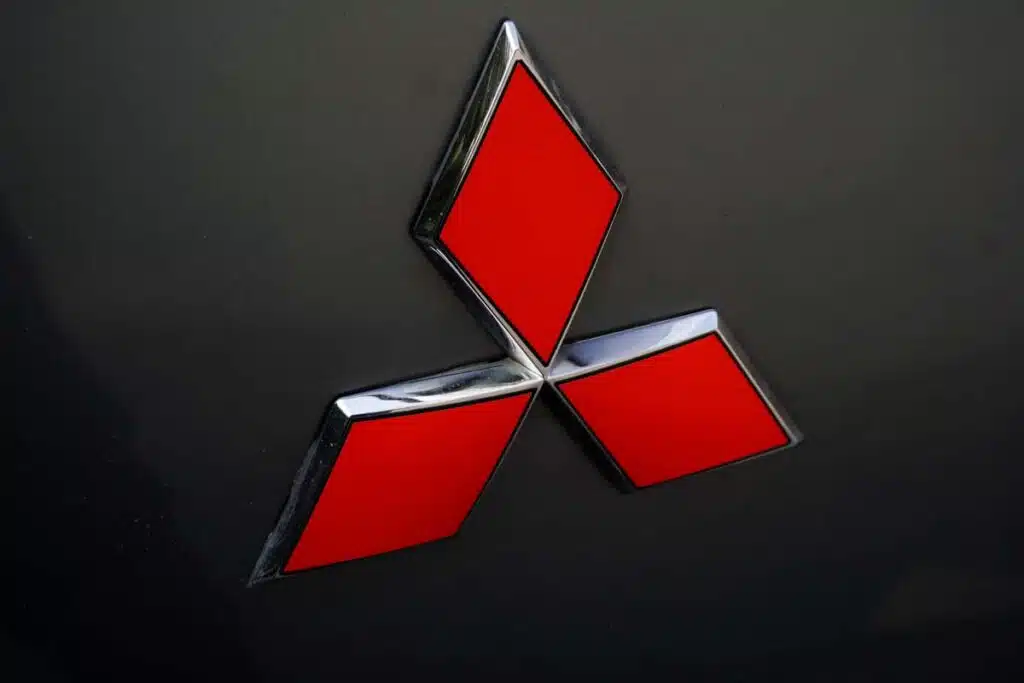 Close up of a Mitsubishi emblem, representing the Mitsubishi seat belt lawsuit verdict.