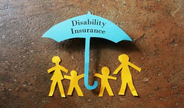 Paper family of four under a paper Disability Insurance umbrella