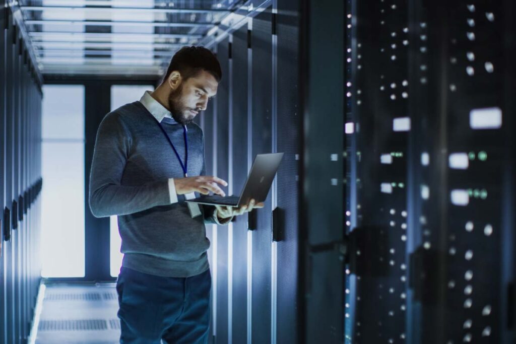 IT worker inside of a server room, representing the Mr. Cooper data breach class action.