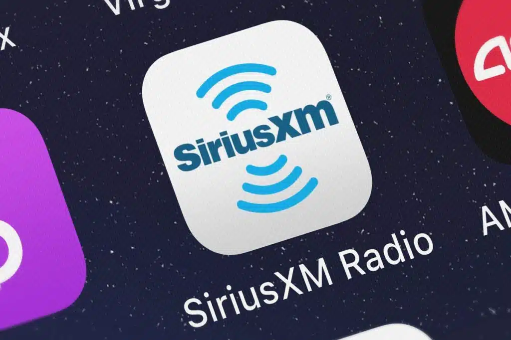 Close up of Sirius XM app icon displayed on a smartphone screen, representing the SiriusXM subscription cancellation lawsuit.
