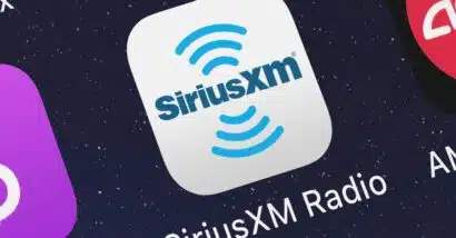 Close up of Sirius XM app icon displayed on a smartphone screen, representing the SiriusXM subscription cancellation lawsuit.