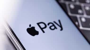 Close up of Apple Pay logo displayed on a smartphone screen, representing the Apple, Mastercard and Visa lawsuit.