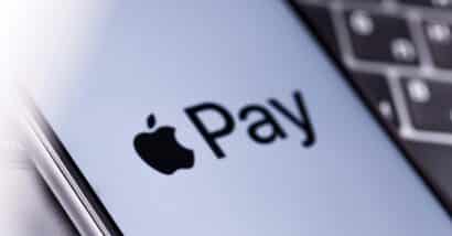 Close up of Apple Pay logo displayed on a smartphone screen, representing the Apple, Mastercard and Visa lawsuit.