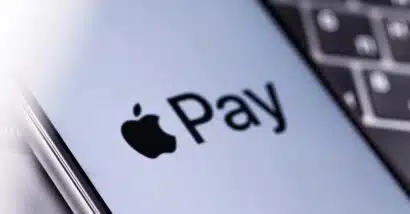 Close up of Apple Pay logo displayed on a smartphone screen, representing the Apple, Mastercard and Visa lawsuit.