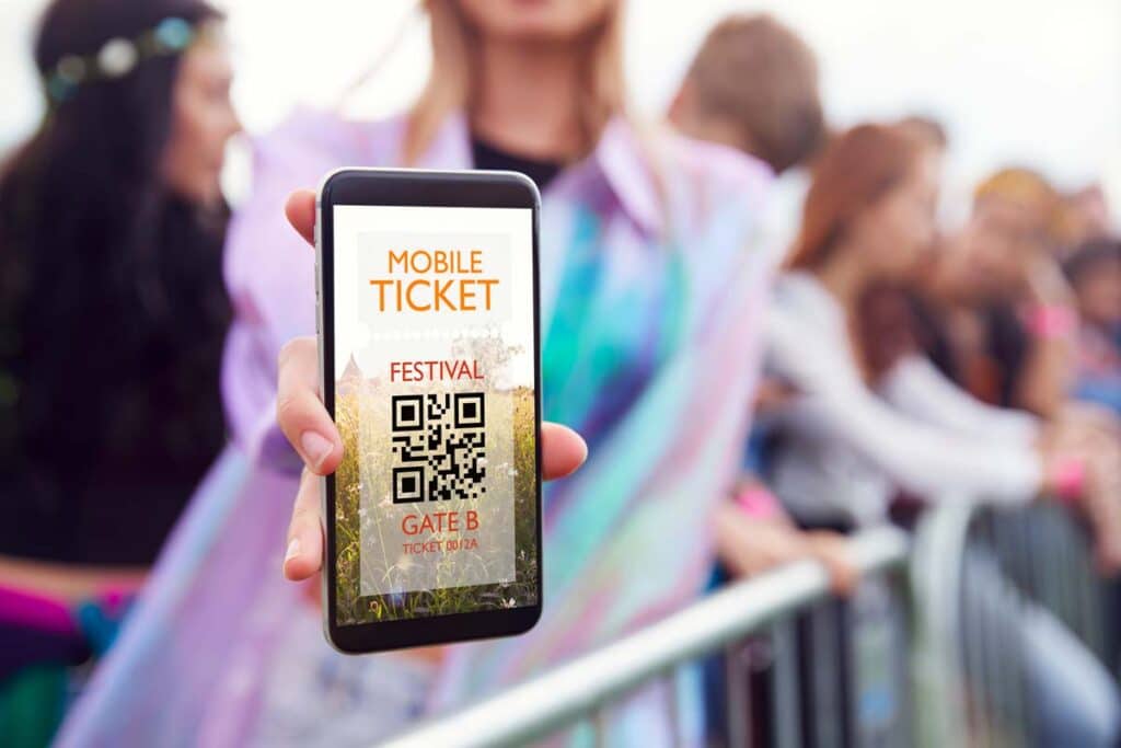 Close up of a mobile ticket displayed on a womans phone, representing the Senate bill addressing ticket prices and fees.