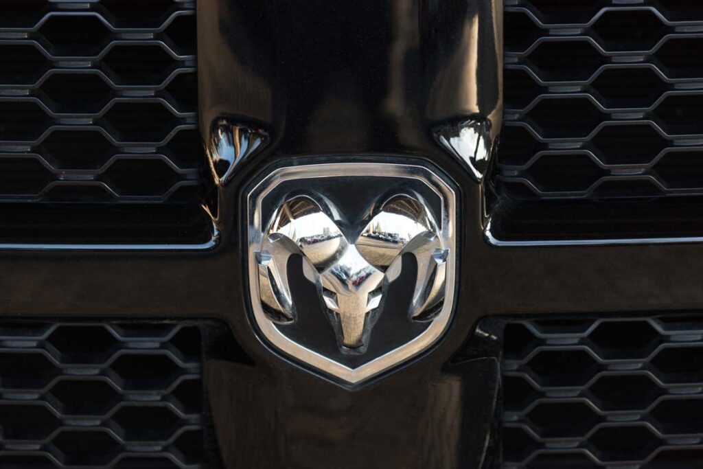 Close up of a Ram emblem on a front bumper, representing the Chrysler Ram and Cab Chassis recall.