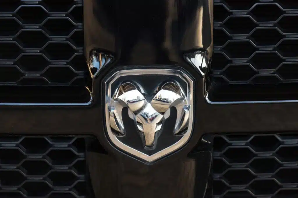 Close up of a Ram emblem on a front bumper, representing the Chrysler Ram and Cab Chassis recall.