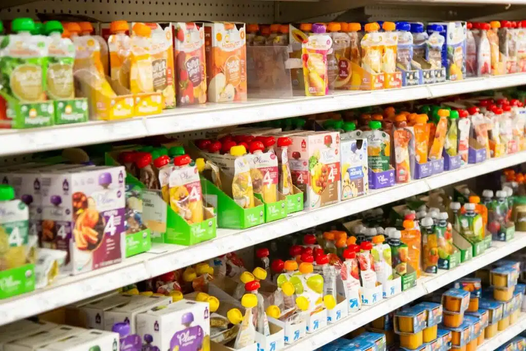 Puree pouches on shelves in a supermarket, representing the Wanabana lead class action.