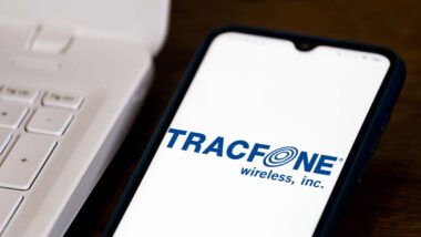 Close up of the Tracfone logo displayed on a smartphone, representing the TracFone settlement.