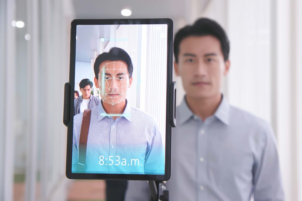 Close up of a man having a facial scan conducted, representing the airport facial recognition bill.