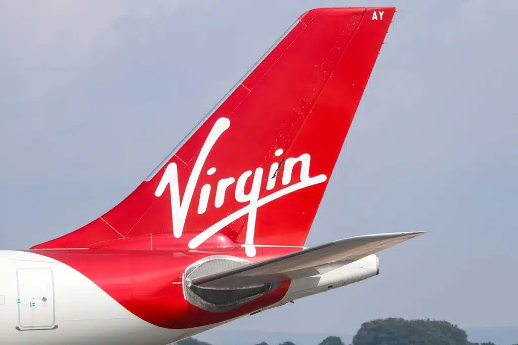 Virgin Atlantic logo on the tail of a plane, representing the flight using Sustainable Aviation Fuel.