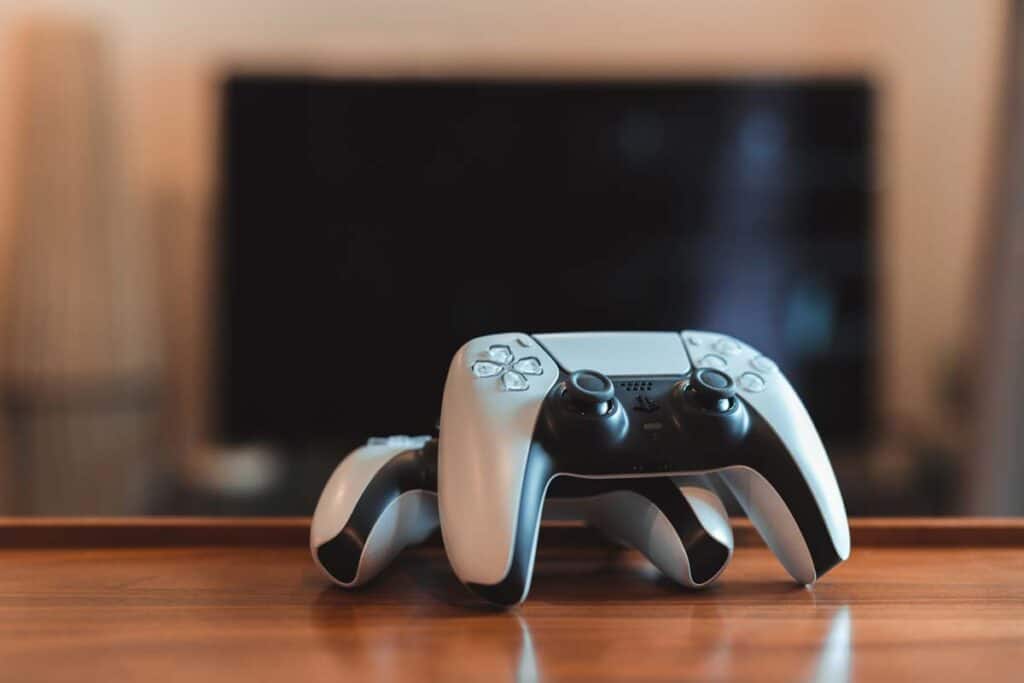 Close up of Playstation gaming controllers, representing the PlayStation permanent suspensions.