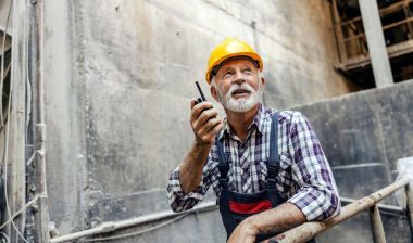 An elderly worker working at a job site, representing older workers.