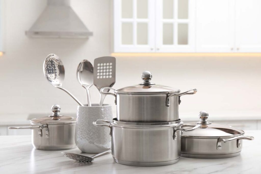 Close up of a set of stainless steel cookware, representing the Boston Foundry class action.