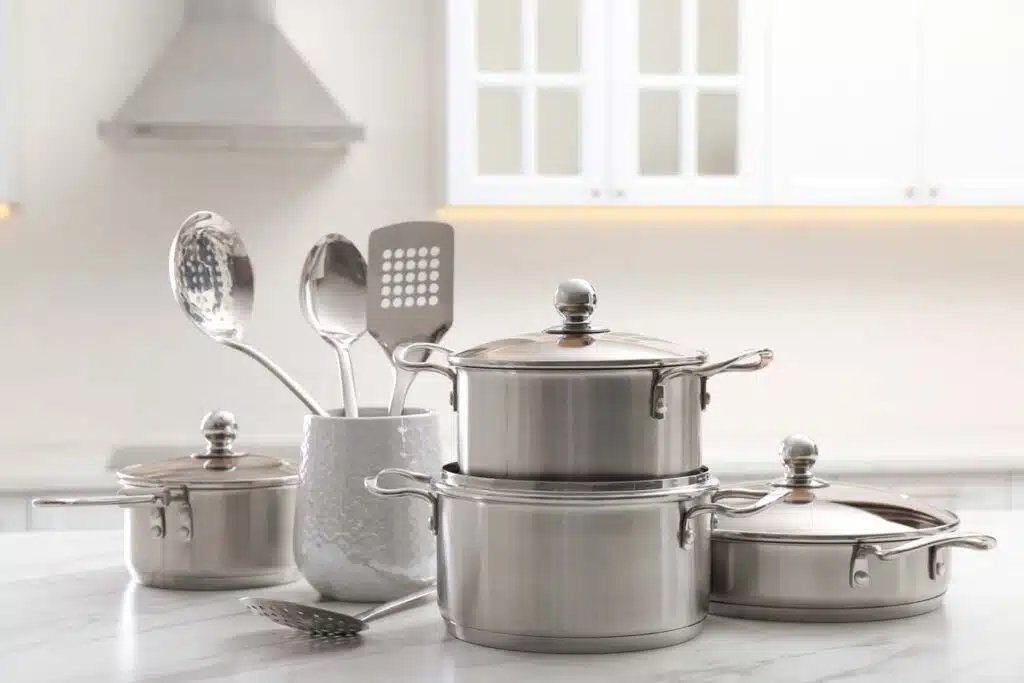 Close up of a set of stainless steel cookware, representing the Boston Foundry class action.