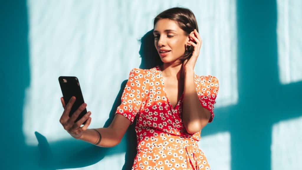smiling female in trendy summer red dress.