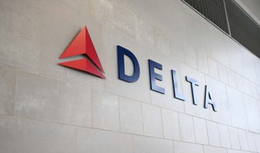 Close up of Delta Airlines signage on a wall, representing the Delta class action.